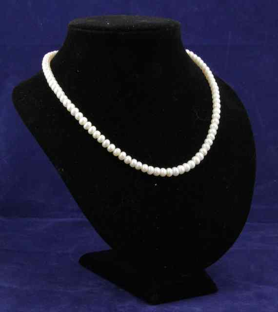 Appraisal: A pearl necklace with faux pearl set clasp cm long