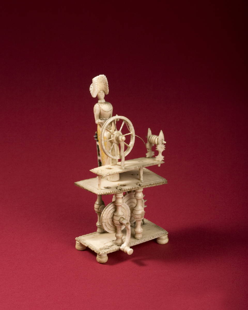 Appraisal: NAPOLEONIC PRISONER-OF-WAR CARVED BONE SPINNING JENNY The seated female wearing