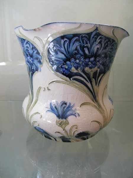 Appraisal: WILLIAM MOORCROFT FLORIAN WARE VASE FAULTS