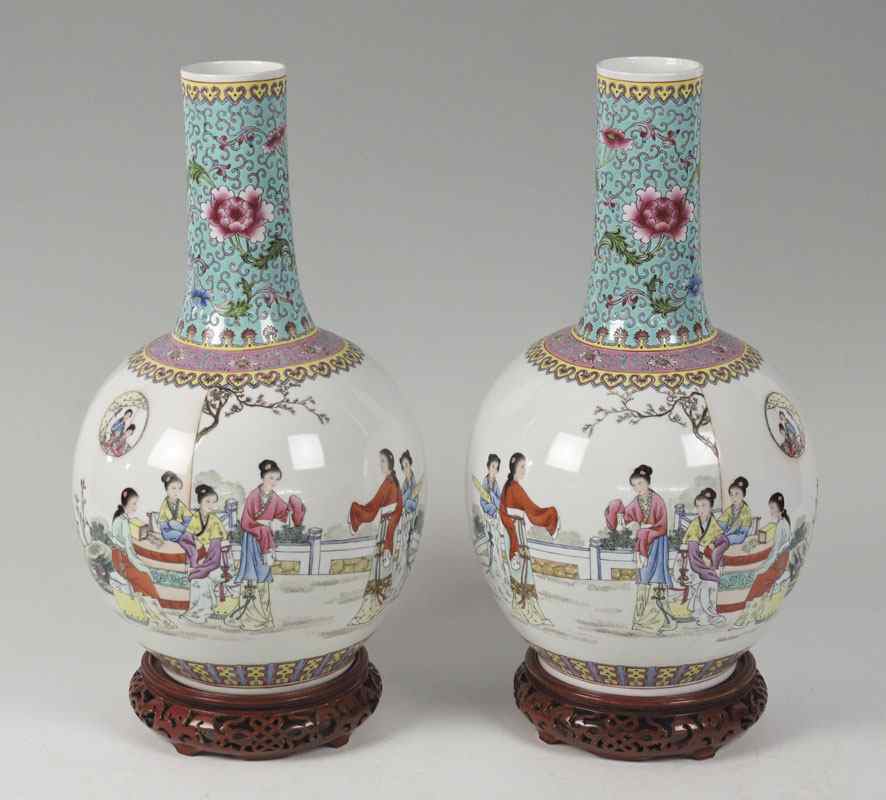 Appraisal: PAIR CHINESE POLYCHROME BOTTLE VASES Mirror images depicting young women