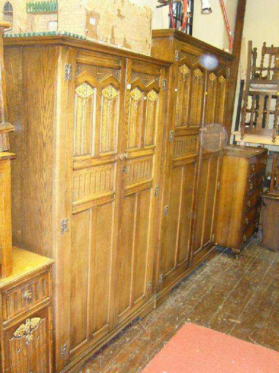 Appraisal: A substantial oak bedroom suite comprising large wardrobe small wardrobe