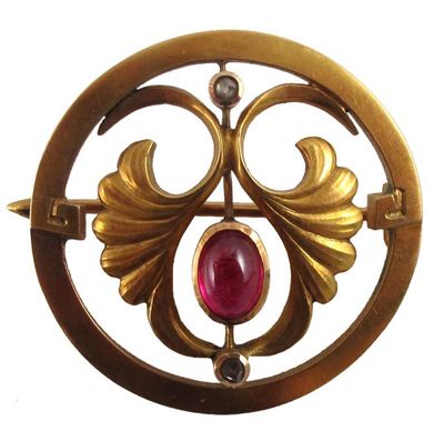 Appraisal: A Russian gold brooch set with a cabochon ruby and