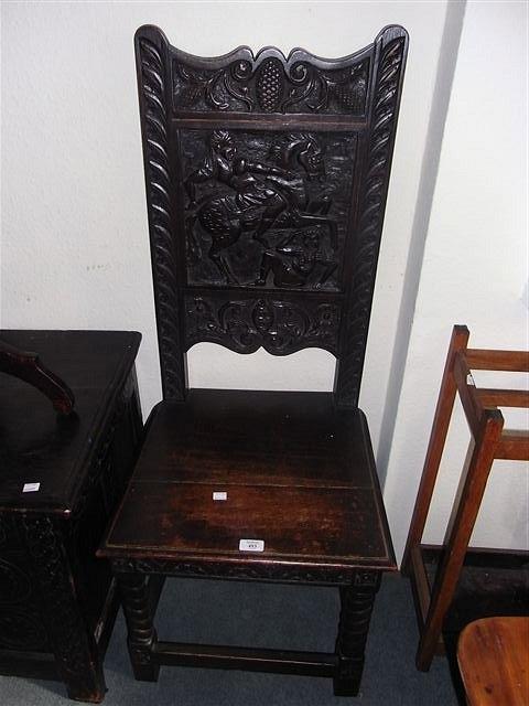 Appraisal: A CARVED OAK HALL CHAIR the back with carved decoration