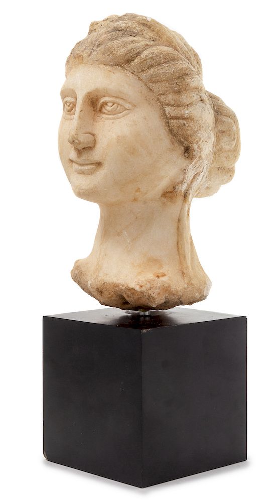 Appraisal: A Carved Marble Head of a Woman A Carved Marble