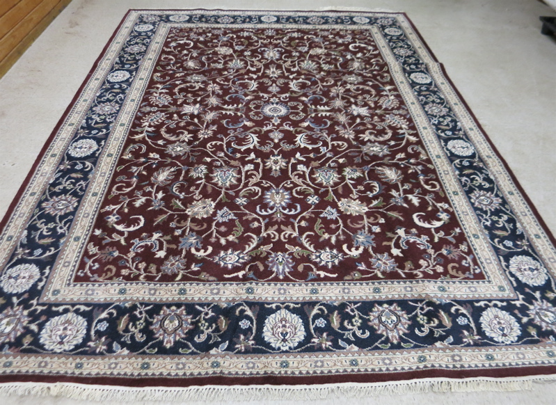 Appraisal: HAND KNOTTED ORIENTAL CARPET Indo-Isfahan featuring scrolling floral racemes on