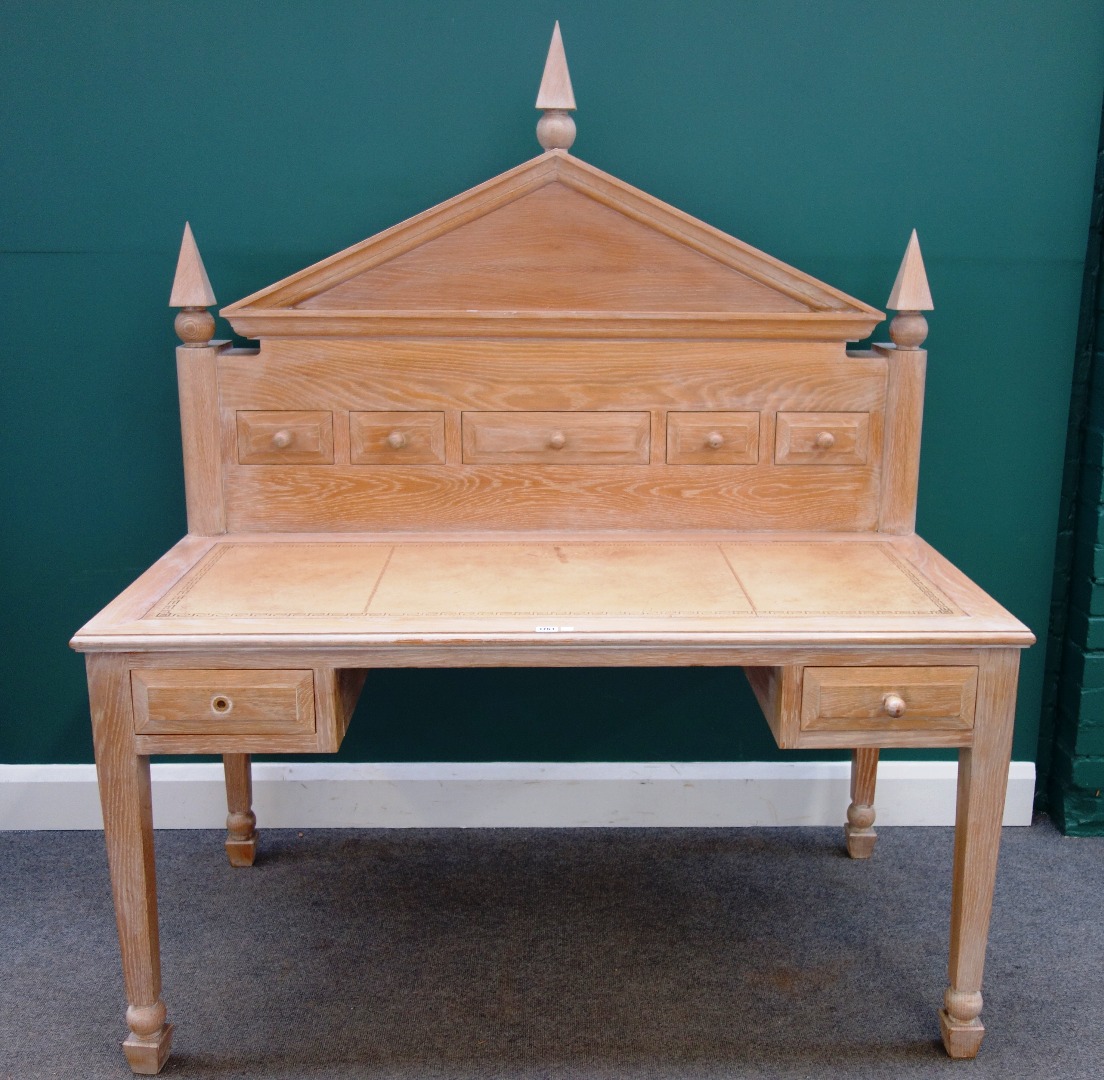 Appraisal: A th century limed oak desk with fitted architectural superstructure