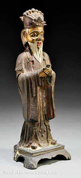 Appraisal: A Chinese Parcel Gilt and Polychrome Decorated Bronze Figure of