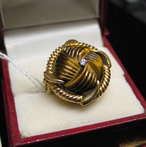 Appraisal: TIGER'S EYE DIAMOND AND FOURTEEN KARAT GOLD RING centering a