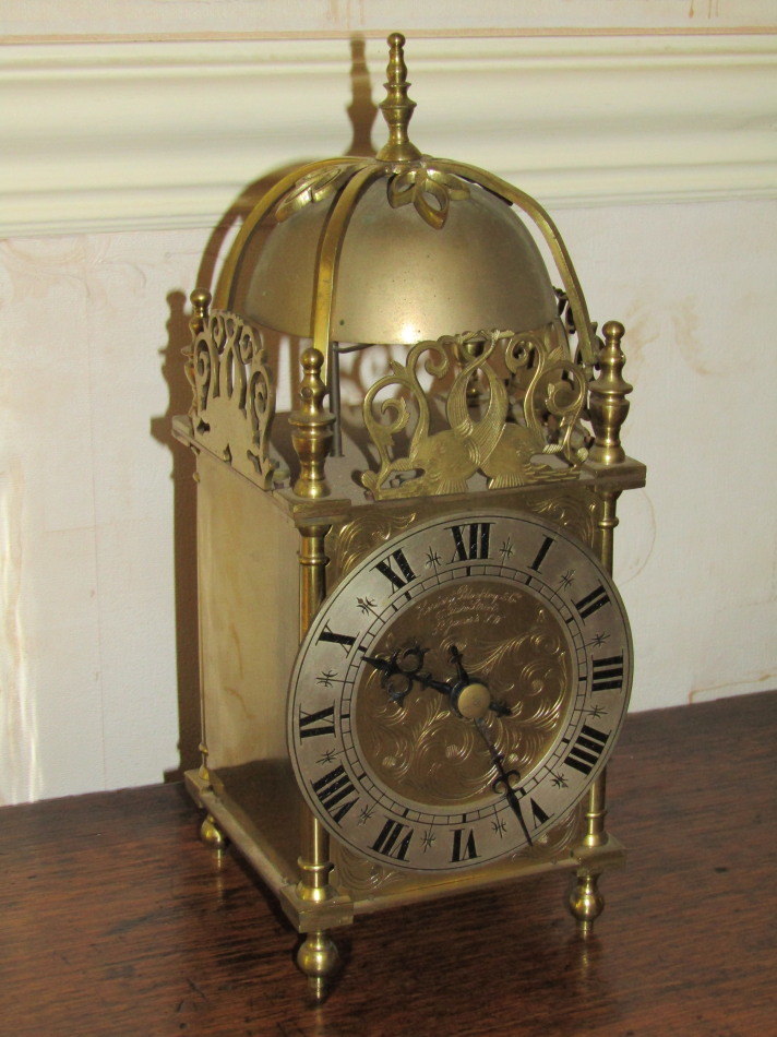 Appraisal: A reproduction brass lantern clock by Herbert Blockley Co Duke