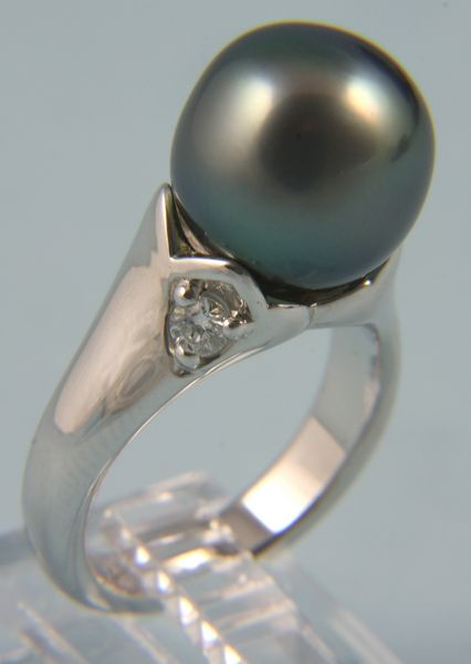 Appraisal: South sea cock pearl diamond and k white gold ring