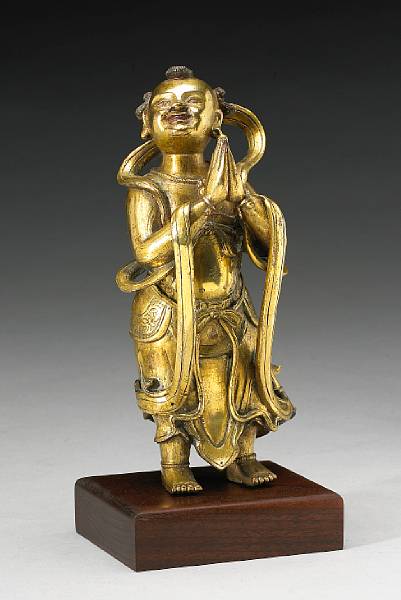 Appraisal: A gilt bronze standing attendant figure th Century Depicting Shancai