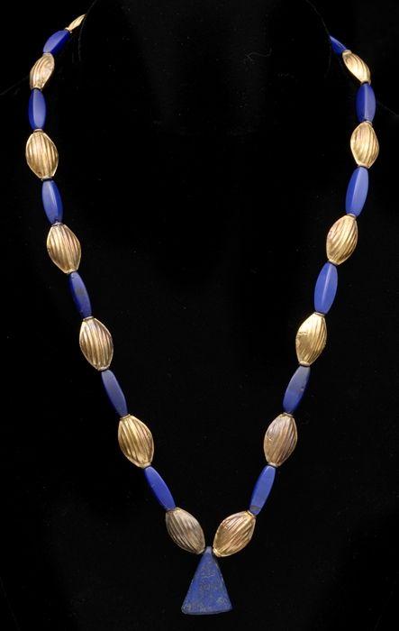 Appraisal: BEADED NECKLACE WITH STONE PENDANT in Provenance Property from the