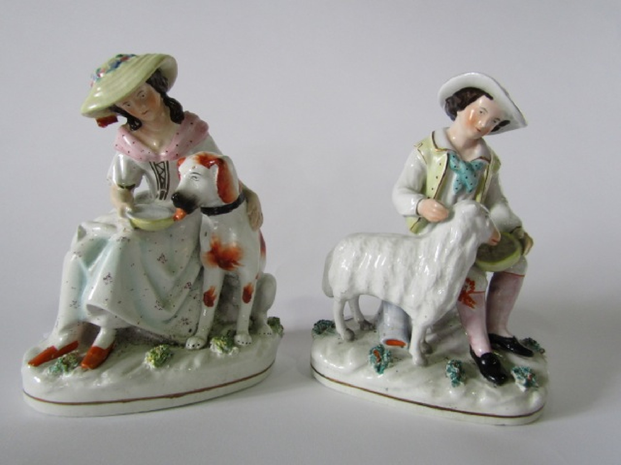 Appraisal: A pair of th century Staffordshire figure groups one of