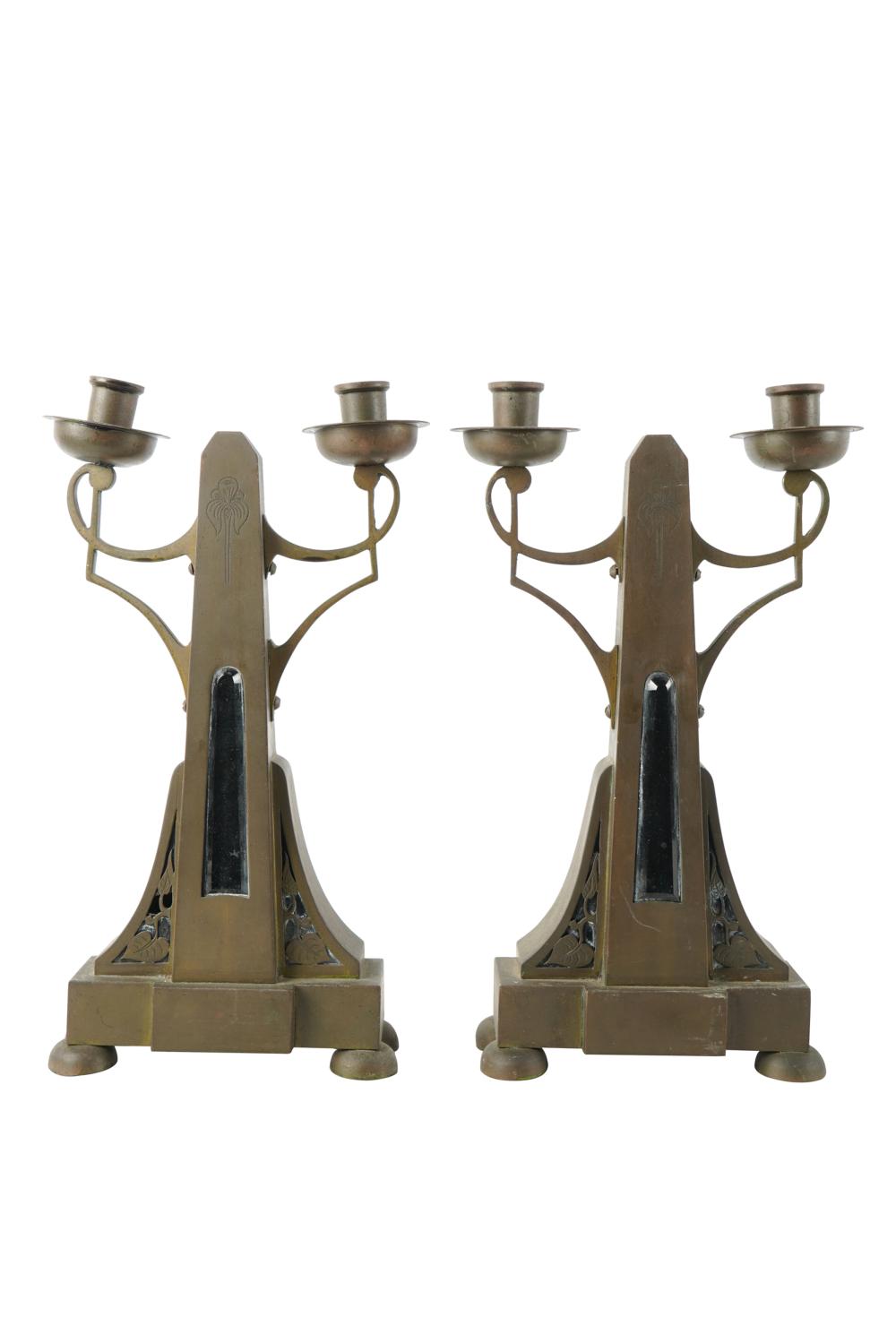 Appraisal: PAIR OF ARTS CRAFTS STYLE TWIN-LIGHT CANDELABRAunsigned metal each with