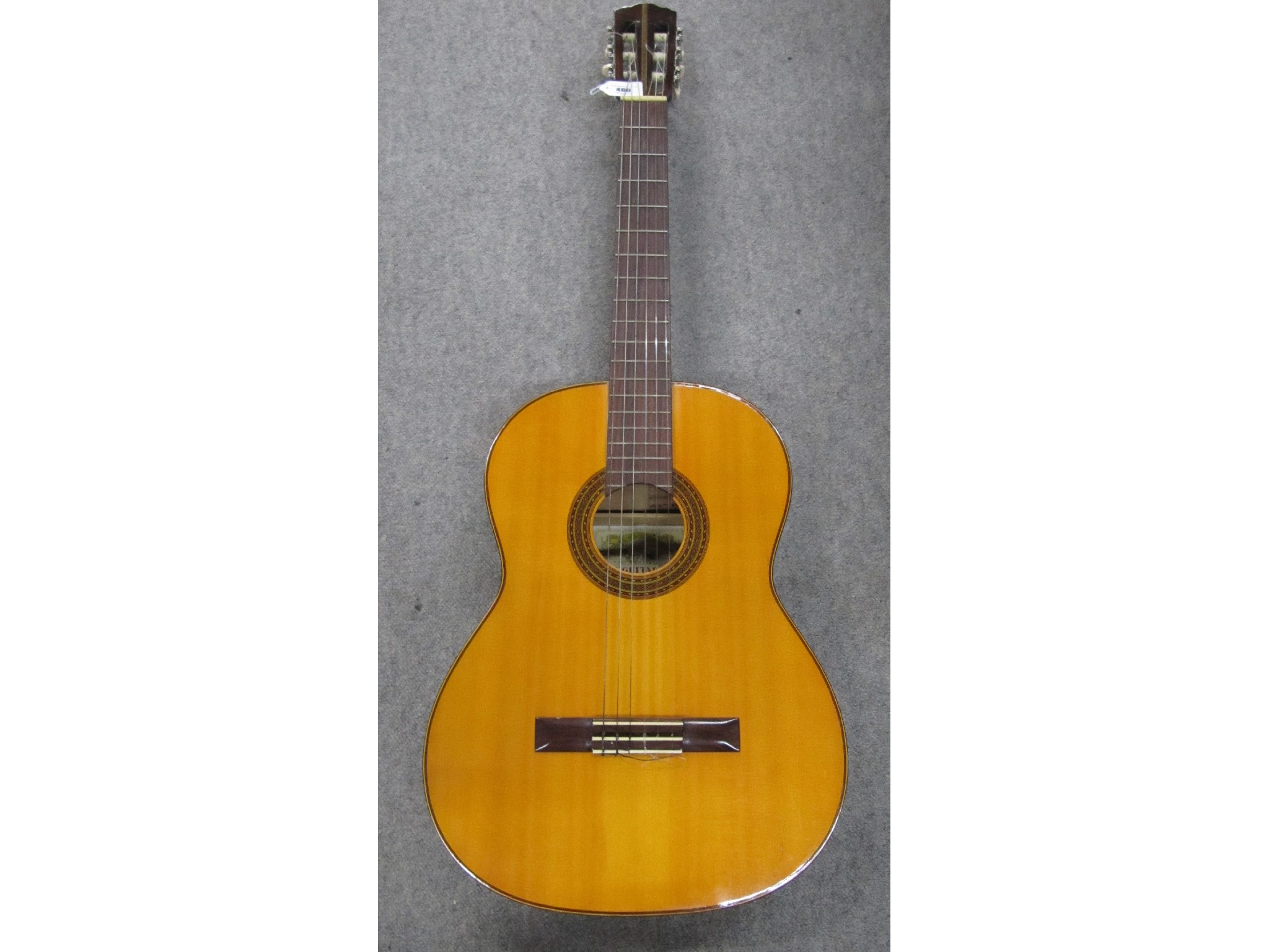 Appraisal: A Suzuki six-string acoustic guitar soft case available