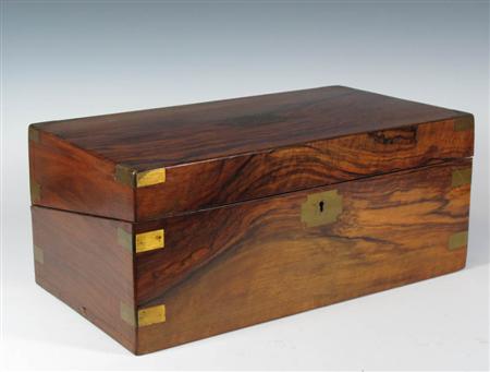 Appraisal: A late Victorian rosewood and brass bound lap desk of