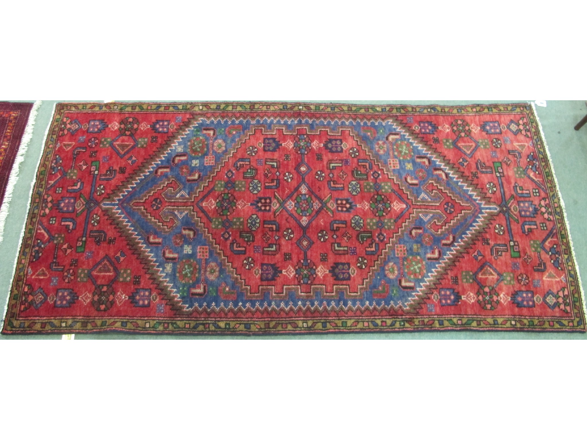 Appraisal: A Hamadan rug on a green blue and red ground