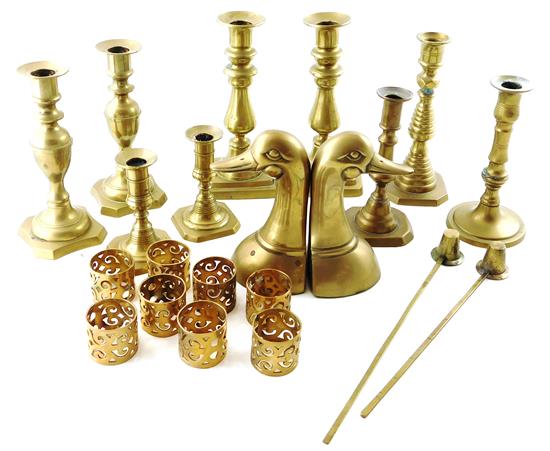 Appraisal: Assortment of brass candlesticks bookends napkin rings and candle snuffers