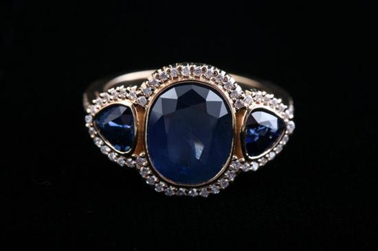 Appraisal: K YELLOW GOLD SAPPHIRE AND DIAMOND RING ct oval blue