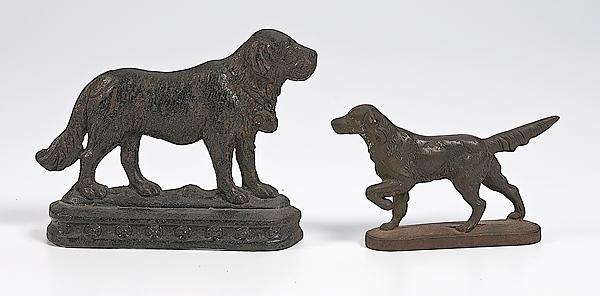 Appraisal: TWO CAST IRON DOG DOOR STOPS St Bernard and English