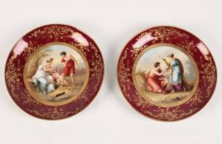 Appraisal: PAIR OF VIENNA PORCELAIN PLATES HAVING CENTRAL FIGURAL RESERVES IN