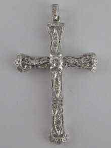 Appraisal: A white metal tests carat gold diamond set cross approx