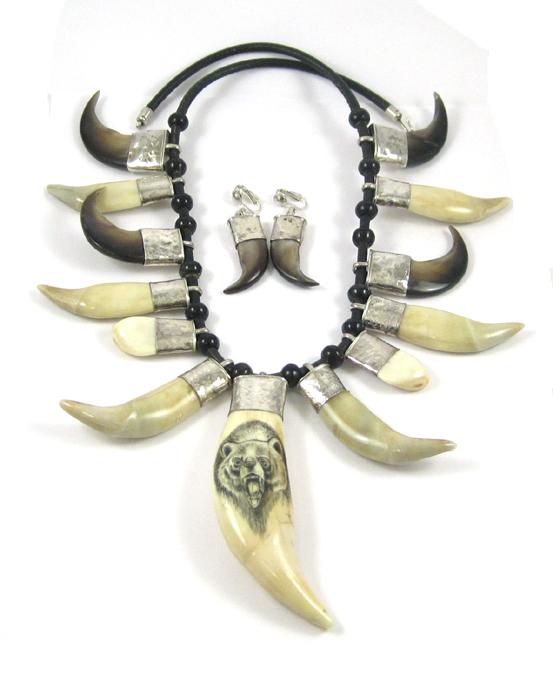 Appraisal: NORTHWEST NATIVE AMERICAN NECKLACE AND EARRINGS the round leather cord