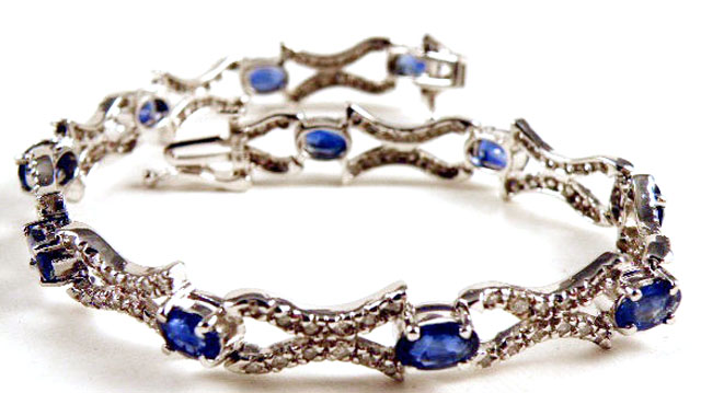 Appraisal: SAPPHIRE AND DIAMOND BRACELET k white gold with oval-cut blue