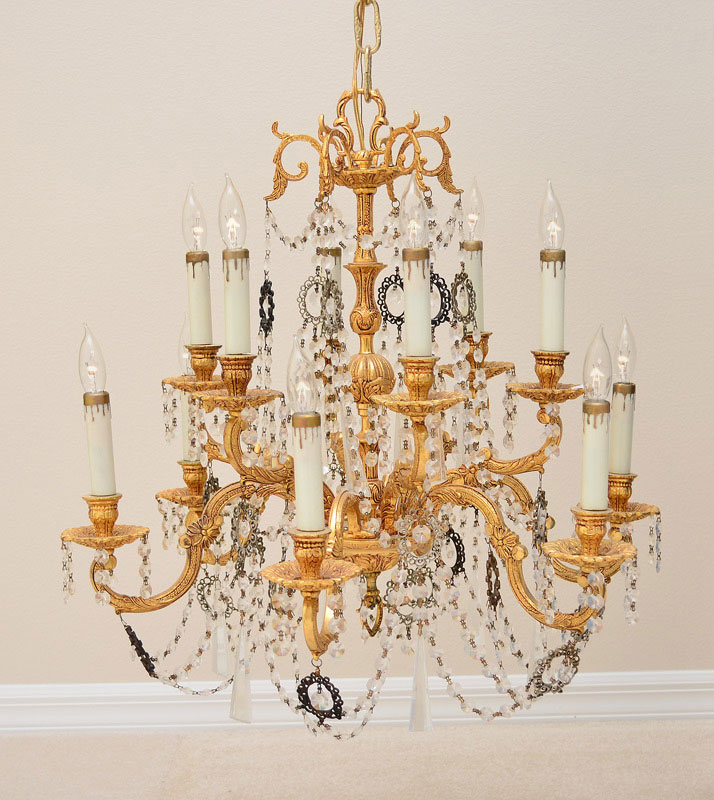 Appraisal: LIGHT GILT METAL AND CRYSTAL CHANDELIER lights on levels gilt