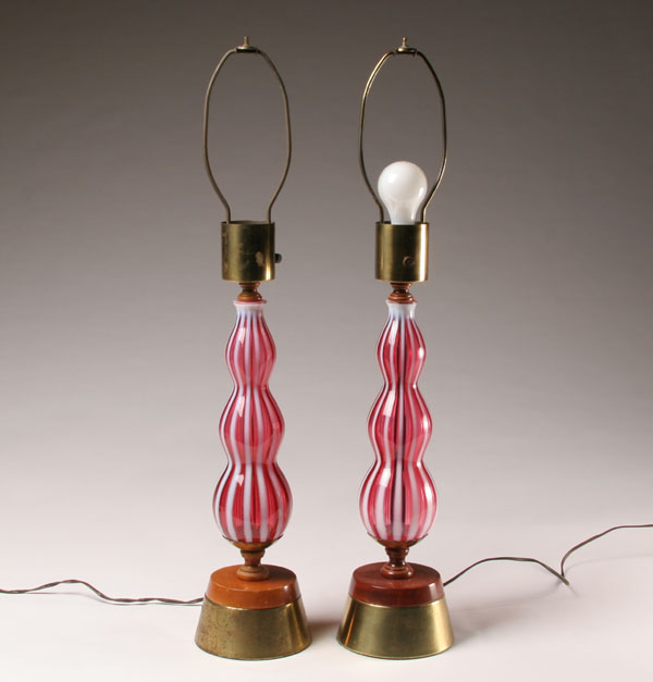 Appraisal: Pair Fenton rib optic glass lamps on wood and brass