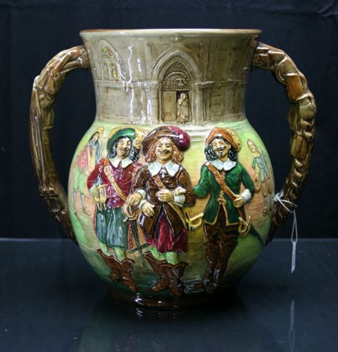 Appraisal: A Royal Doulton 'Three Musketeers' loving cup by Noke edition