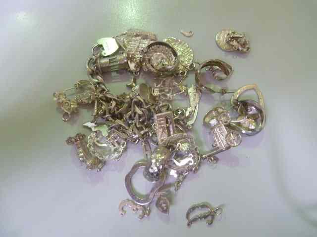 Appraisal: A COLLECTION OF VARIOUS SILVER AND WHITE METAL CHARMS