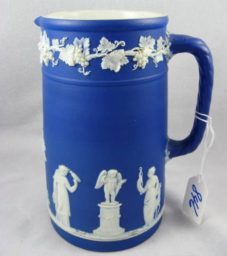 Appraisal: A PAIR OF ENGLISH BLUE JASPERWARE CREAM AND SUGAR decorated