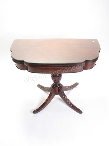 Appraisal: A Duncan Phyfe style mahogany tilt top table with carved