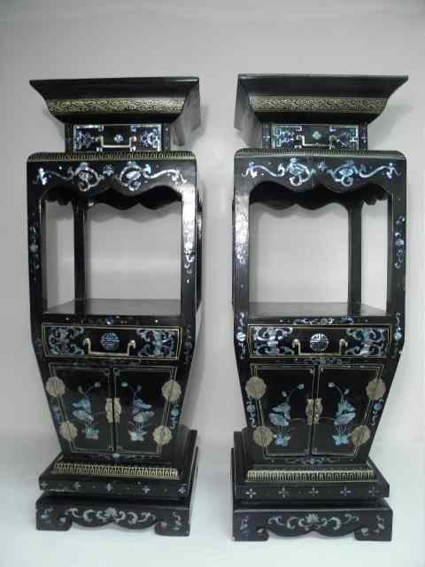 Appraisal: Pair of Chinese black lacquer plant stand pedestals decorated with