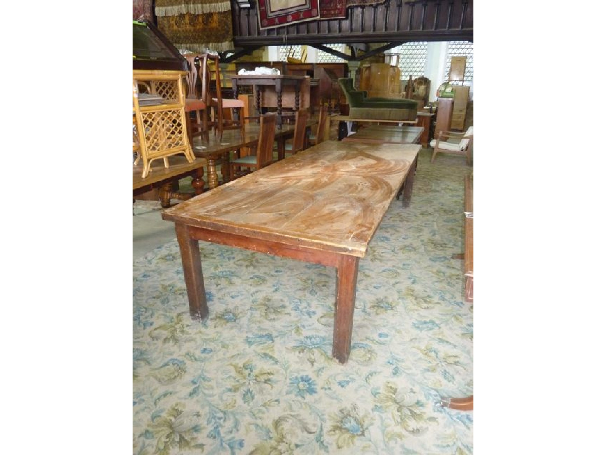 Appraisal: A substantial stripped pine farmhouse kitchen table of rectangular form