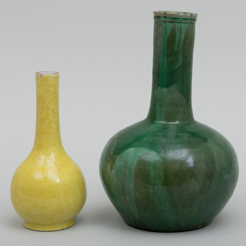 Appraisal: Two Chinese Porcelain Monochrome Vases The green vase with incised