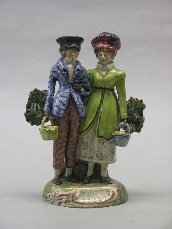 Appraisal: A late th century Staffordshire pearl ware figure group husband