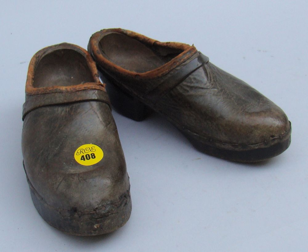 Appraisal: PAIR OF CHILD'S WOOD AND LEATHER SHOES th Century