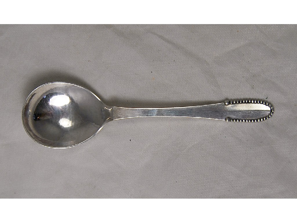 Appraisal: A 's Georg Jensen preserve spoon with planished bowl and