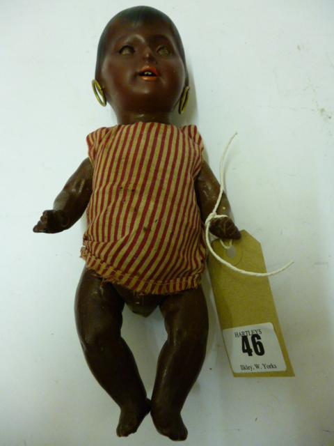 Appraisal: A Heubach Koppelsdorf Mulatto bisque head doll sleeping dark brown