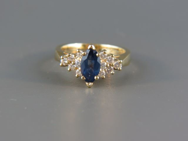 Appraisal: Sapphire Diamond Ring elegant vivid blue marquise gem weighing carats