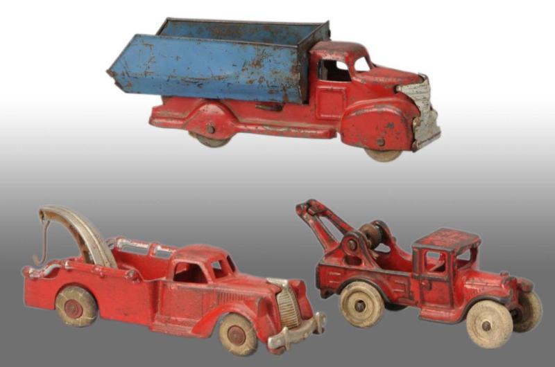 Appraisal: Lot of Cast Iron Pressed Steel Vehicle Toys Description American