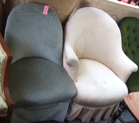 Appraisal: A th century walnut tub back nursing chair with outswept