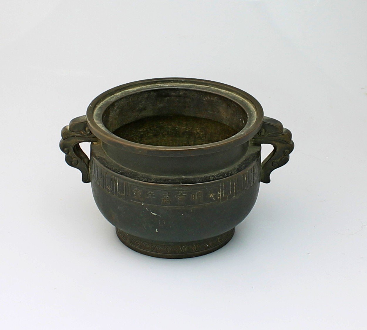 Appraisal: A Chinese bronze censer with two handles Ming marks but