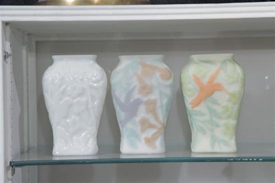 Appraisal: THREE CONSOLIDATED GLASS RELIEF DECORATED ART GLASS HUMMINGBIRD VASES Each