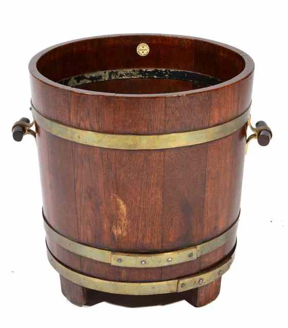 Appraisal: A LISTER CO COOPERED TEAK AND BRASS BOUND BUCKET with