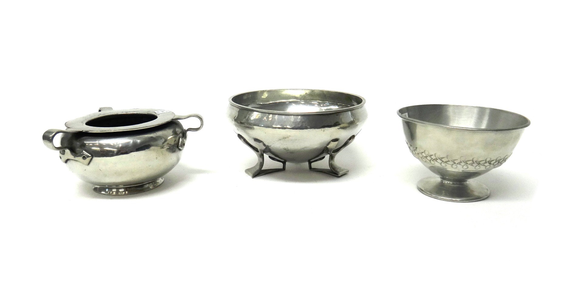 Appraisal: Three Tudric pewter footed bowls circa comprising a round shaped