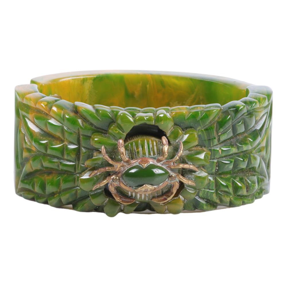 Appraisal: BAKELITE DEEPLY CARVED GREEN CLAMPER BRACELET WITH APPLIED BRASS CRAB