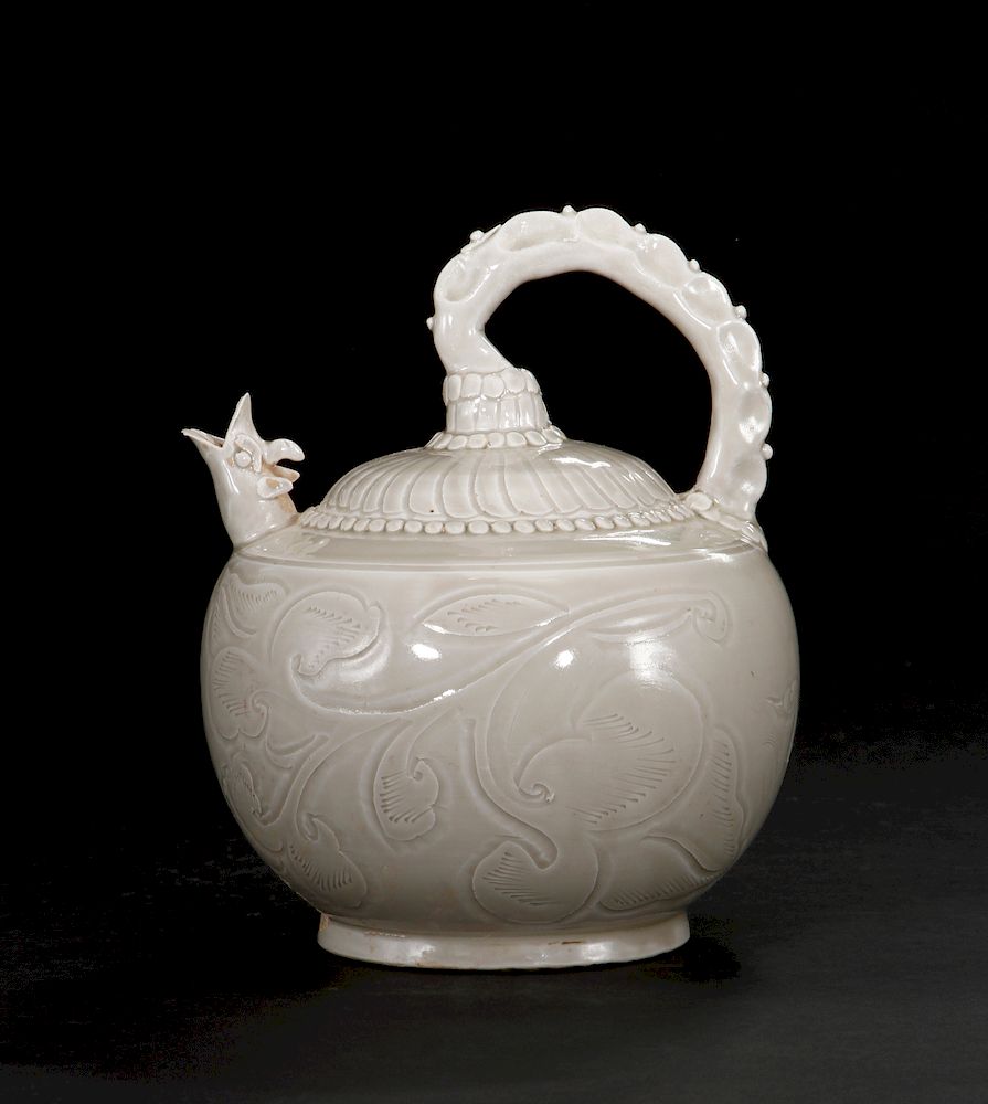 Appraisal: Rare Ding Ware Relief-Carved Ewer Of globular body with a